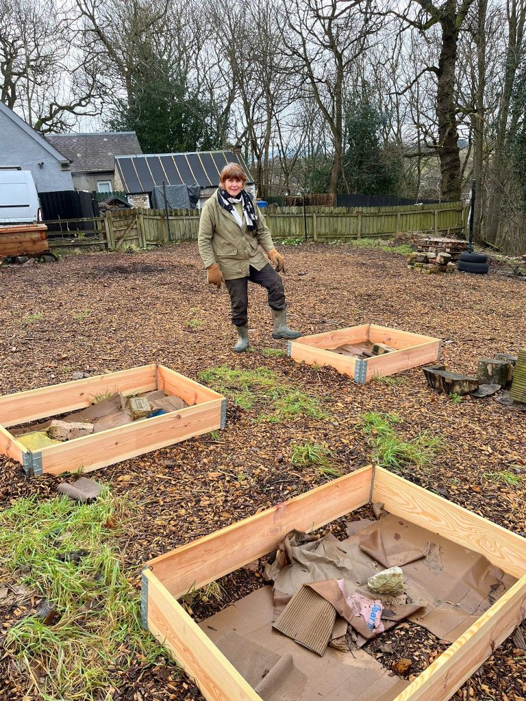 Di and the installment of our first raised growing beds 